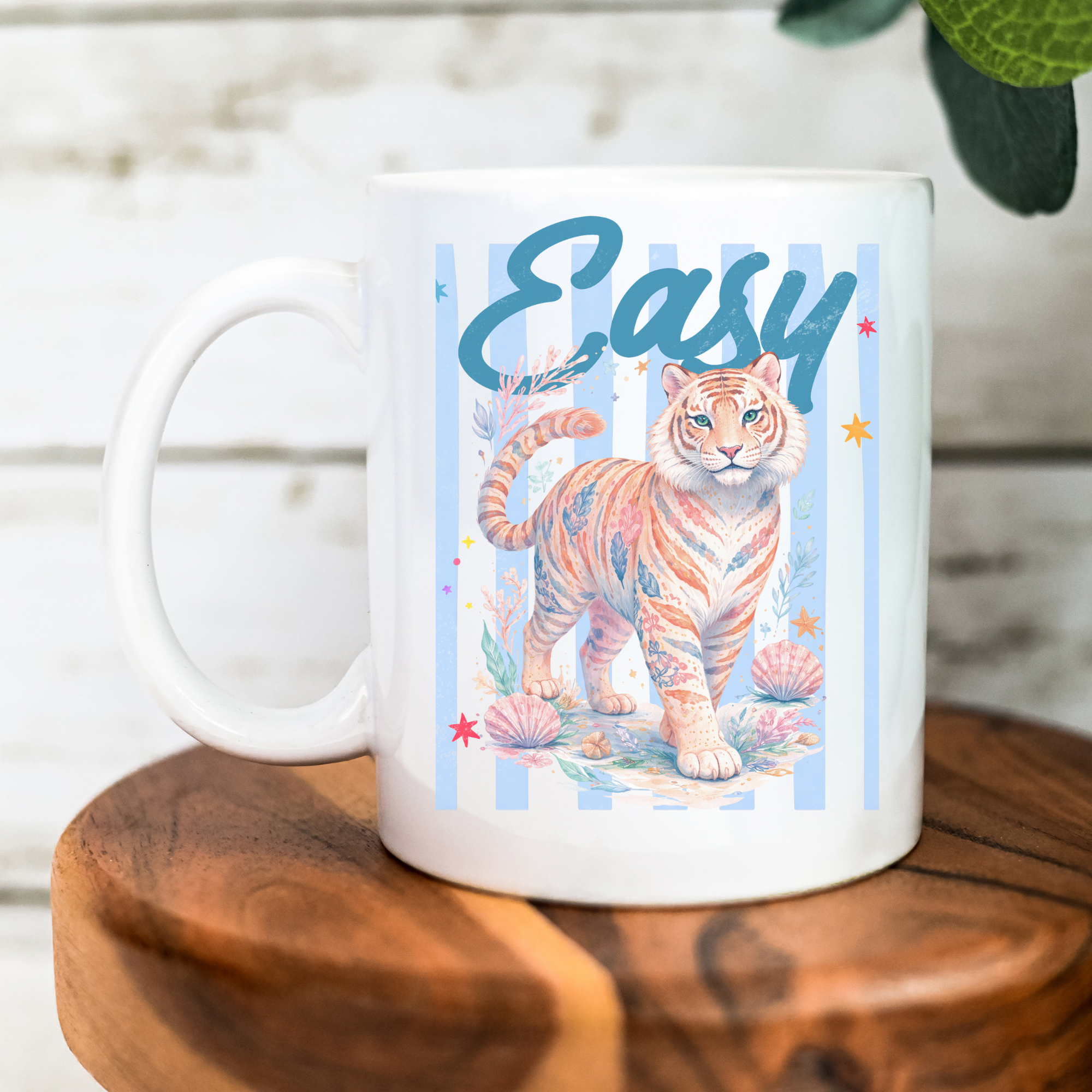 11oz. white mug with a tiger illustration and 'Easy' text on a wooden surface.