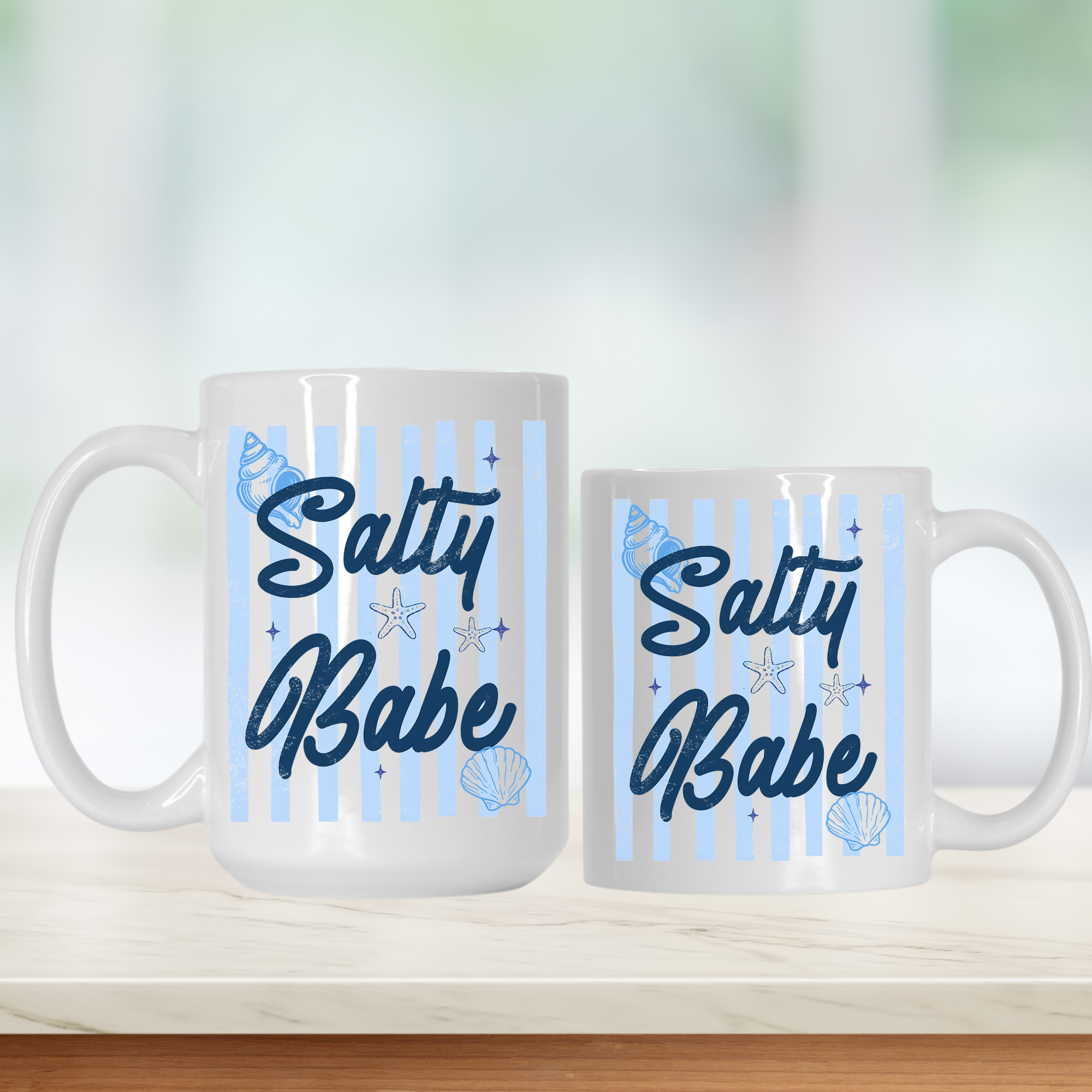 15oz & 11oz. mugs with 'Salty Babe' text on a light background