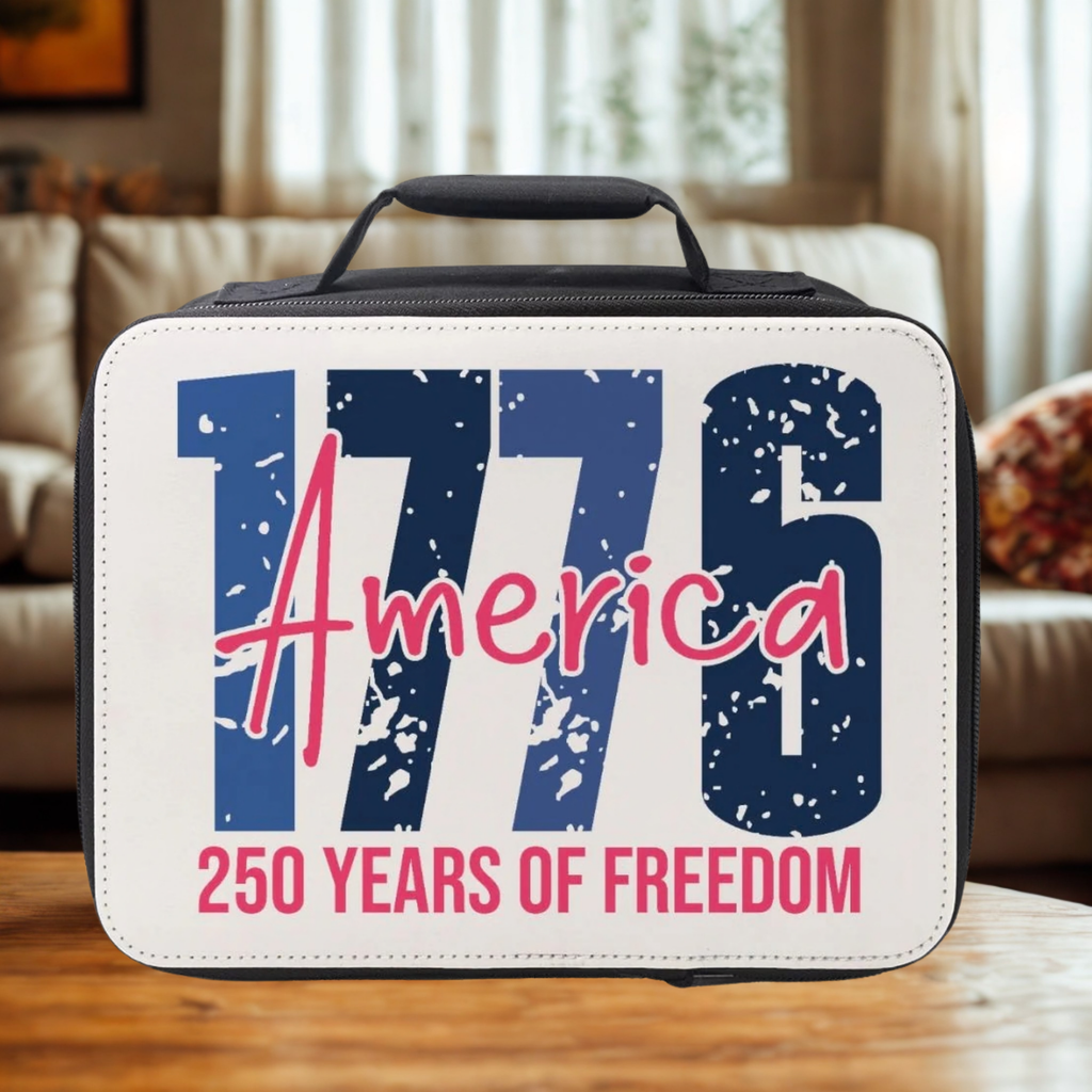 Lunch bag with '1776 America 250 Years of Freedom' text on a wooden living room table.