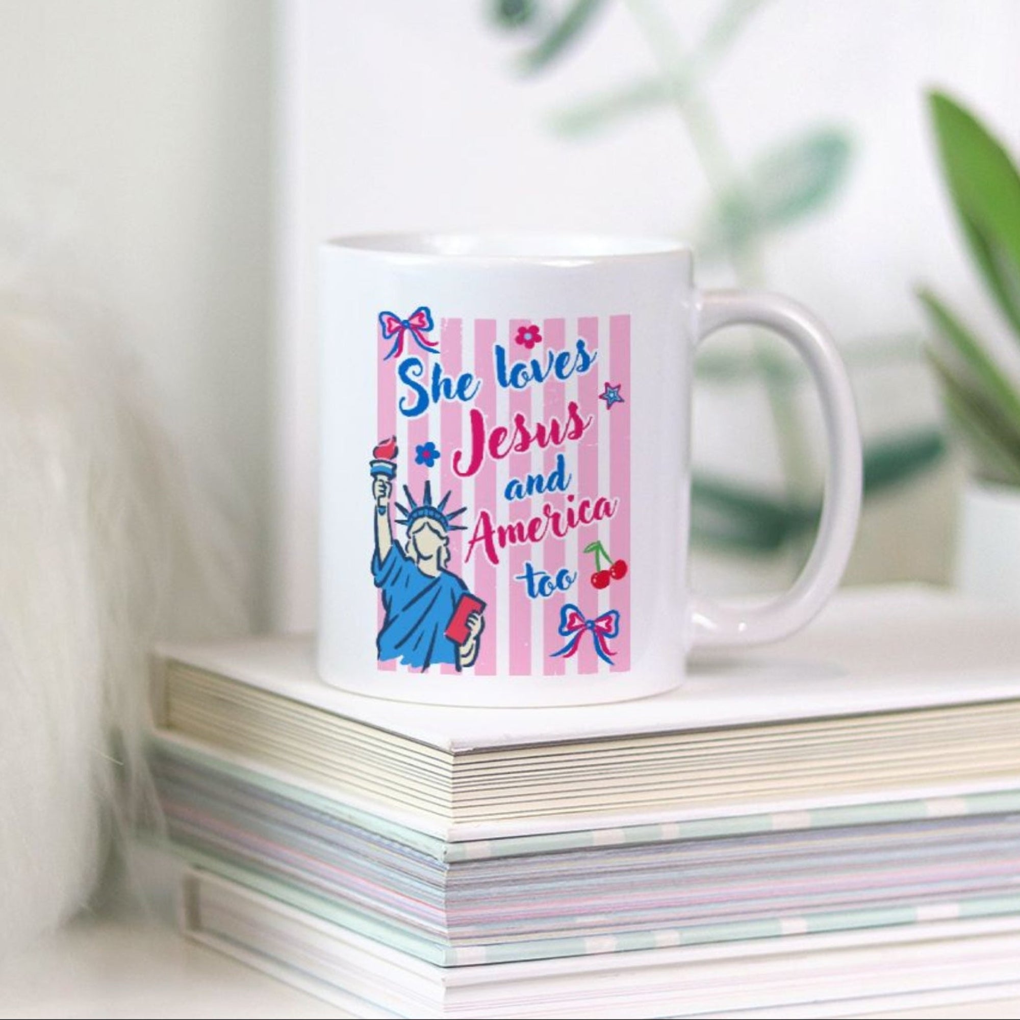 11oz Mug with a trendy colorful striped Christian design and text on a stack of books with a plant in the background