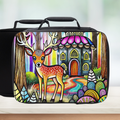 Colorful lunch bag with a deer and fairy tale castle design on a wooden surface.