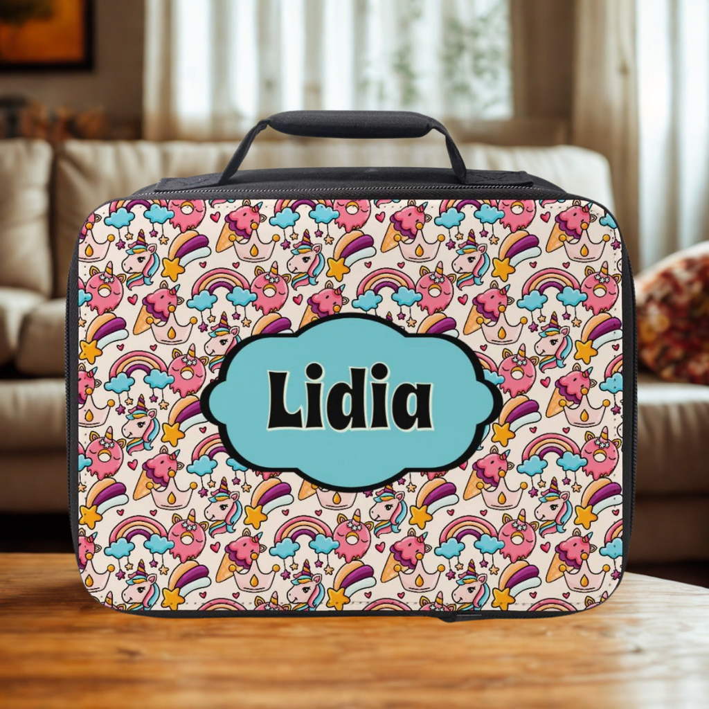 Colorful rainbow unicorn patterned lunch bag with 'Lidia' custom text on a wooden coffee table in a cozy living room.
