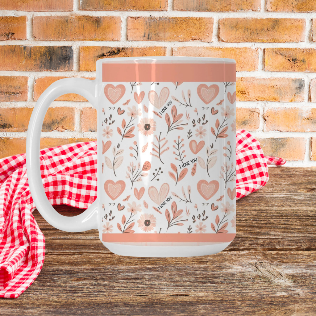 White mug with floral and heart pattern on a wooden picnic table with a brick wall background