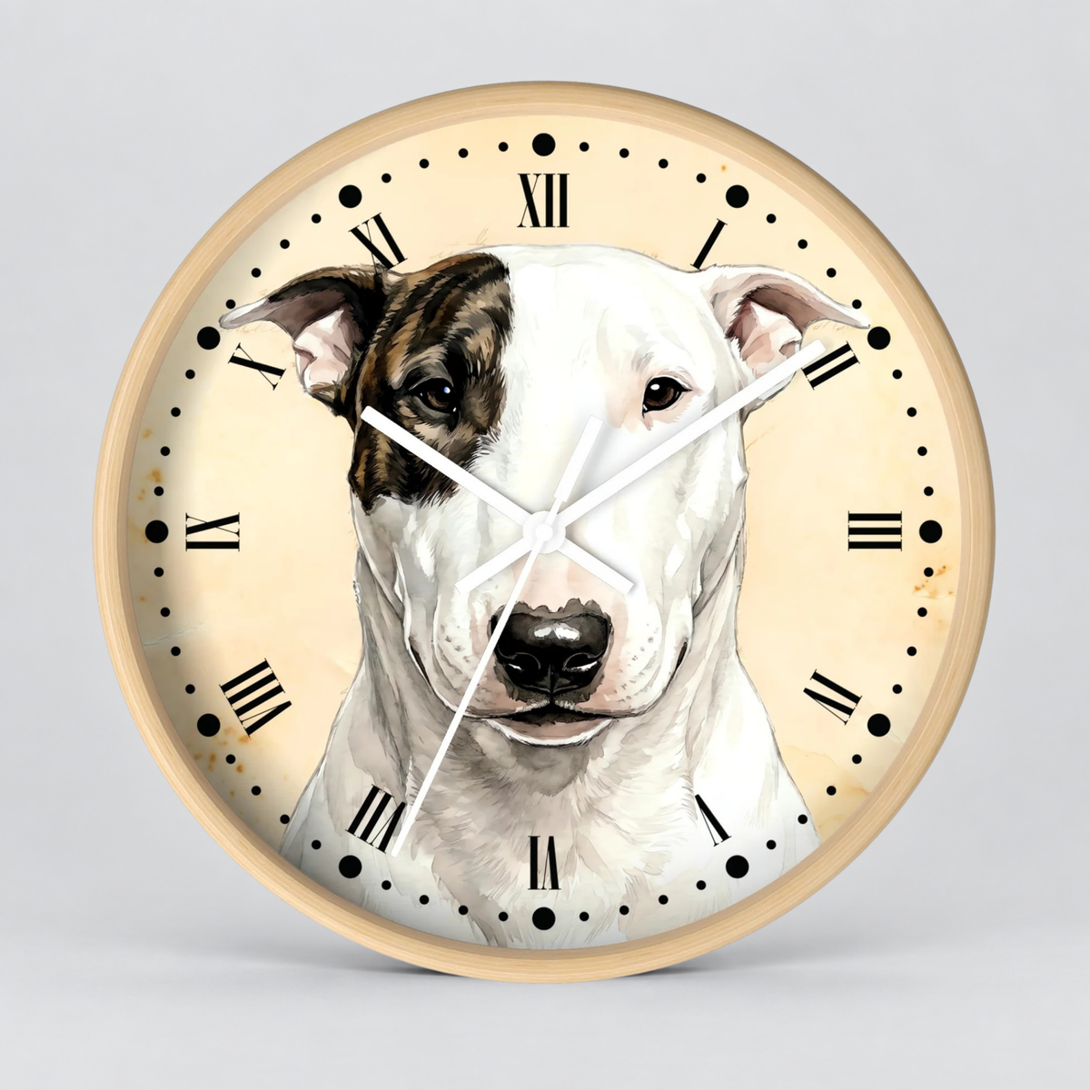 Round wall clock with a light wood-toned frame and a printed illustration of a white and brown dog on the face. The clock face has a warm cream background with black Roman numerals and black dot hour markers, and white clock hands.
