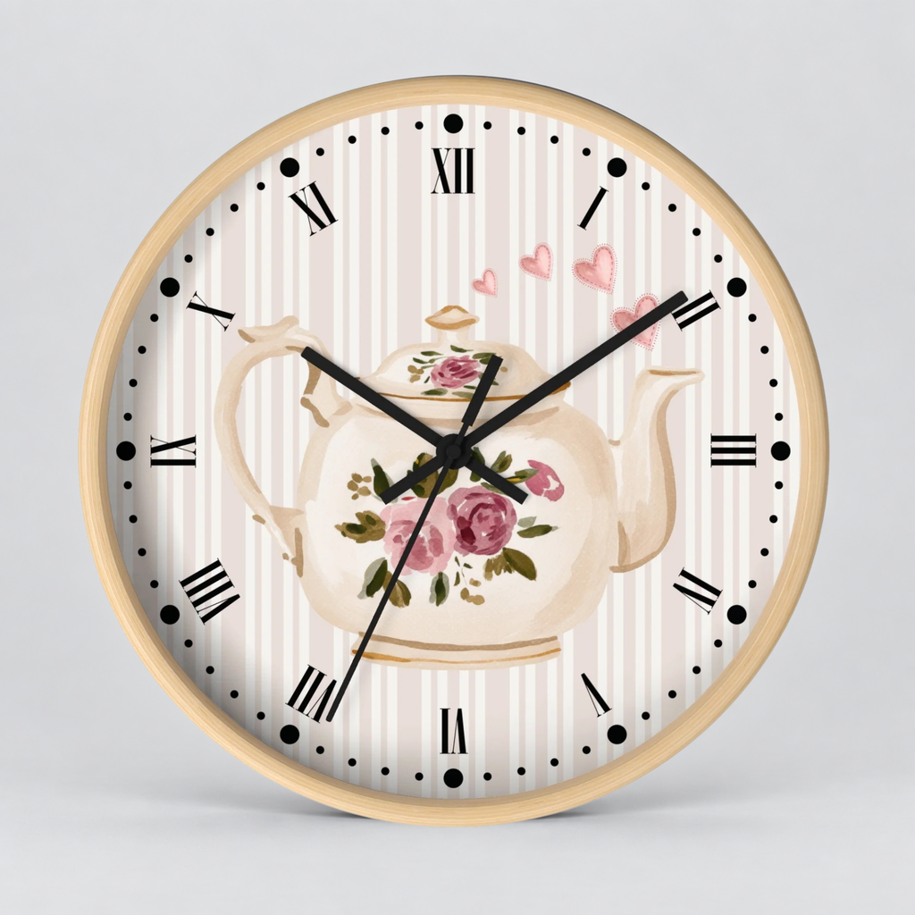 Round wall clock with a light wood frame, featuring a cream and white striped dial, a central floral teapot illustration with pink roses, black Roman numerals, and black clock hands on a light gray background.