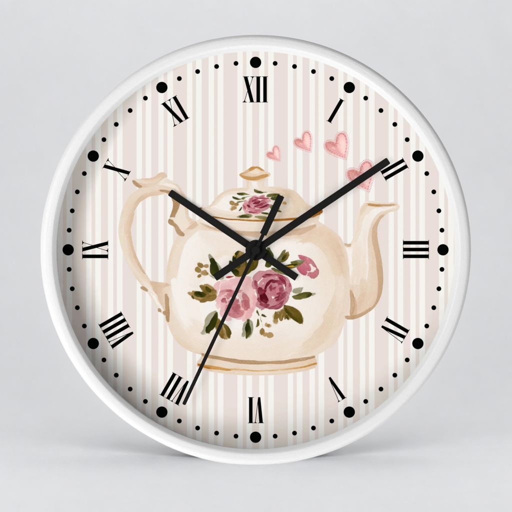 Round wall clock with a white frame, featuring a vintage-style floral teapot illustration on a cream and pink striped dial with black Roman numerals and hands.