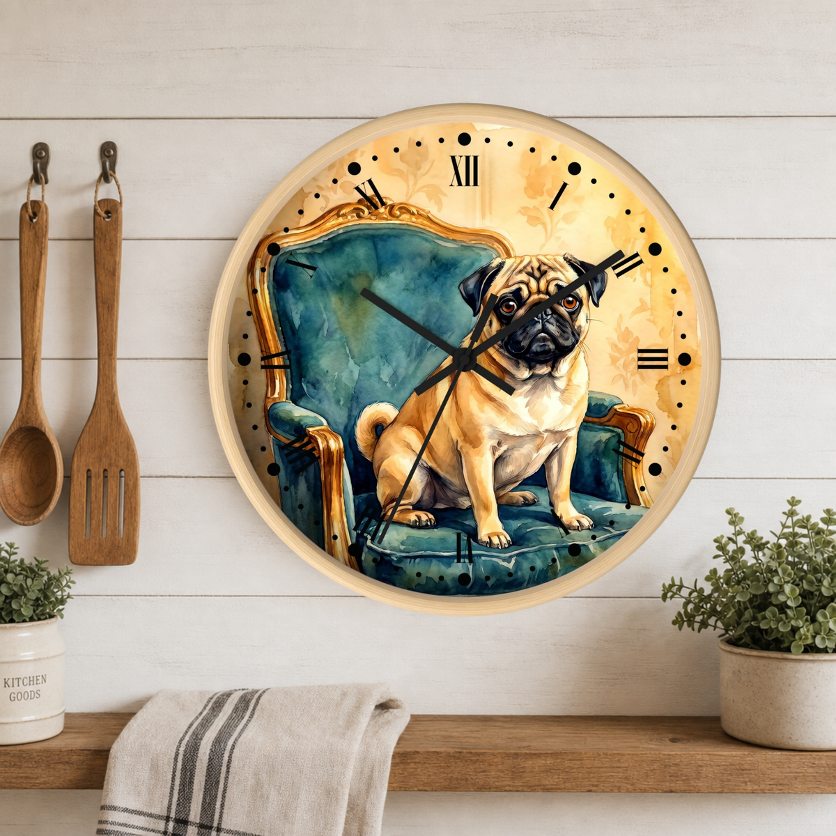 A round wall clock featuring a painted pug sitting in a teal armchair, mounted on a white wood-paneled wall above a shelf with plants and utensils.