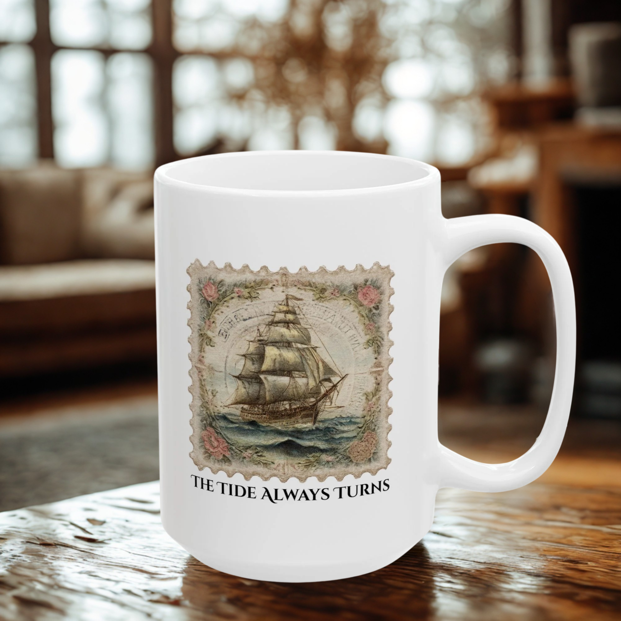 White mug with vintage ship design and text 'The Tide Always Turns' on a wooden surface.