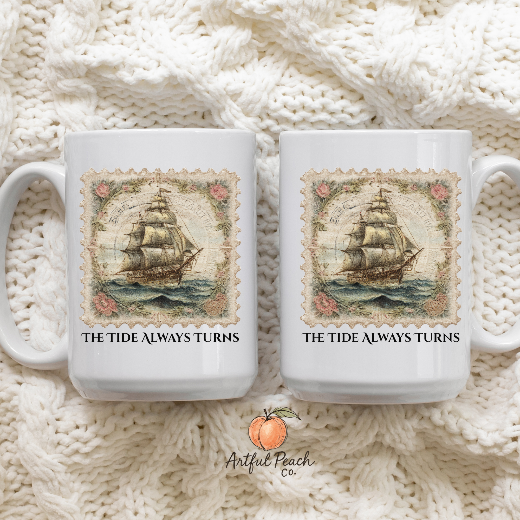 Two white mugs with ship design and 'The Tide Always Turns' text on a knitted fabric background, featuring the Artful Peach logo.