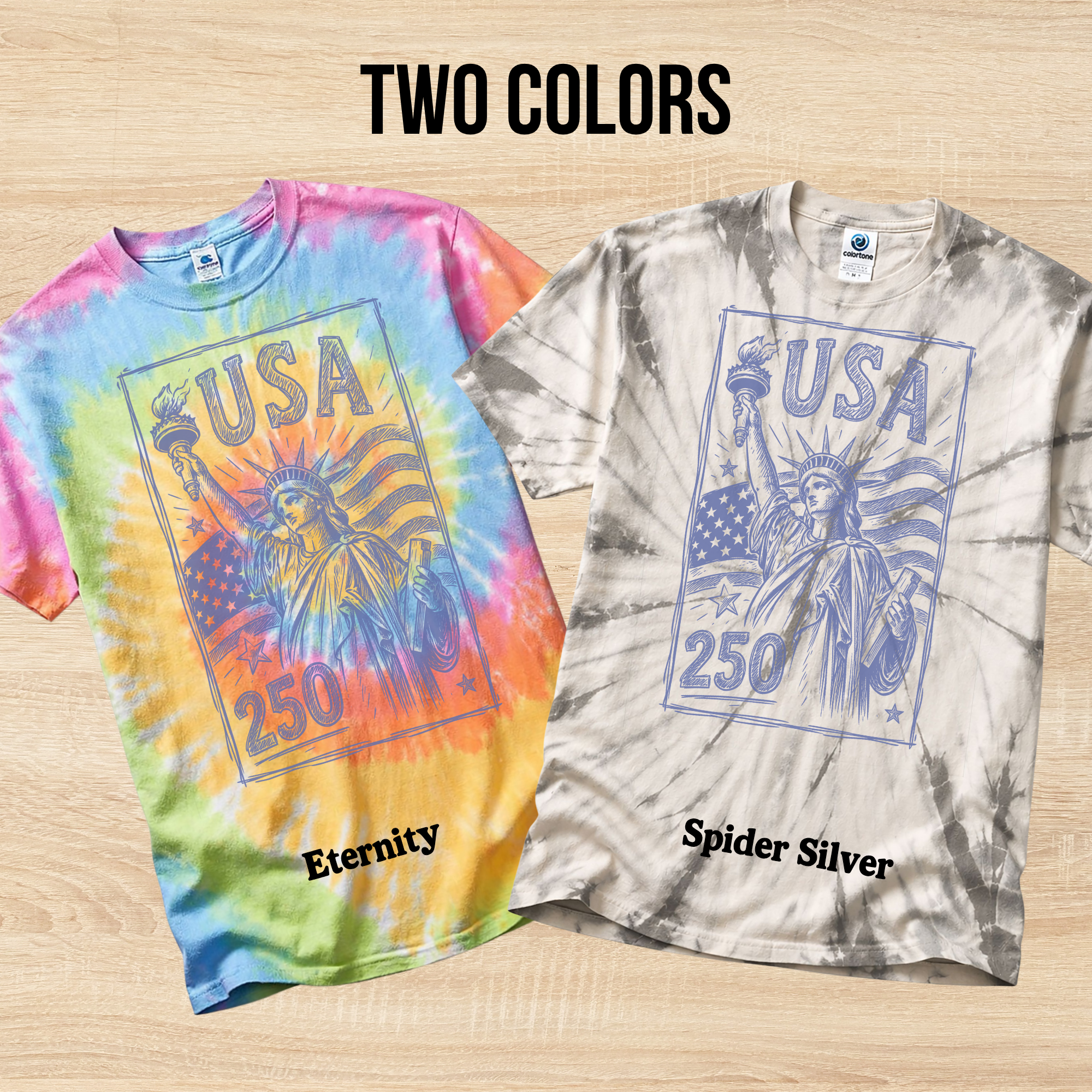 Two tie-dye t-shirts in the colors Eternity and Spider Silver with 'USA 250' design on a wooden surface.