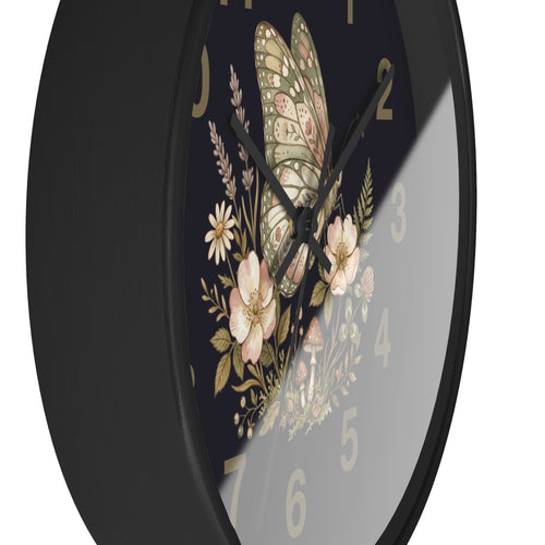 Side view of a round black Wall clock with butterfly and floral design on a black background