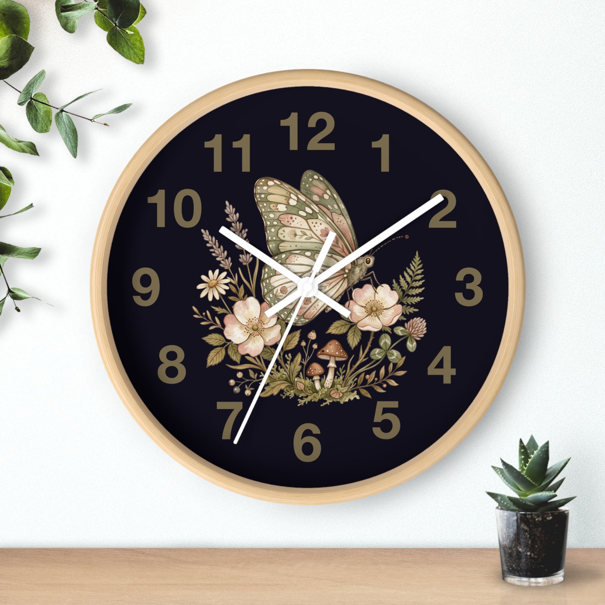 Decorative round natural wood wall clock with white hands and floral butterfly design.