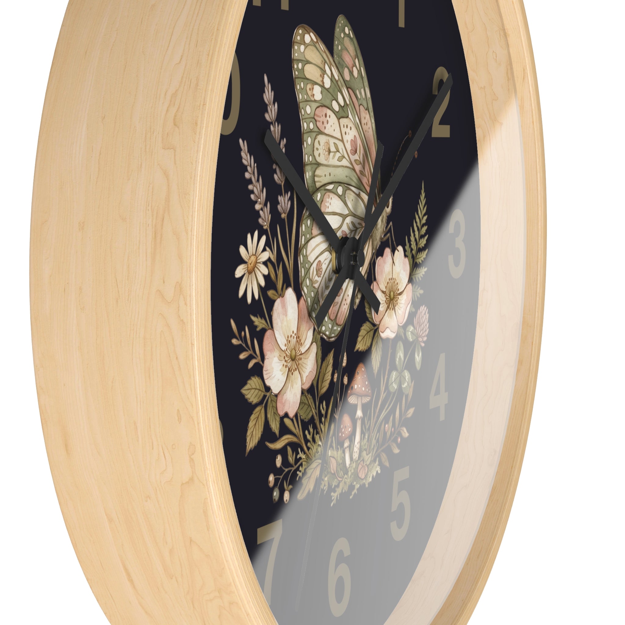 Side view of a decorative round natural wood wall clock with a floral butterfly design on a black background