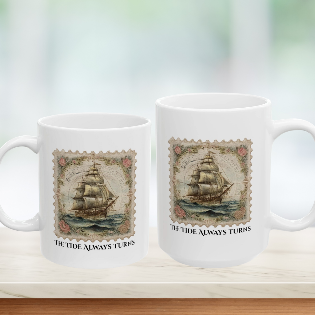 Two white mugs with ship design and 'The Tide Always Turns' text on a light background