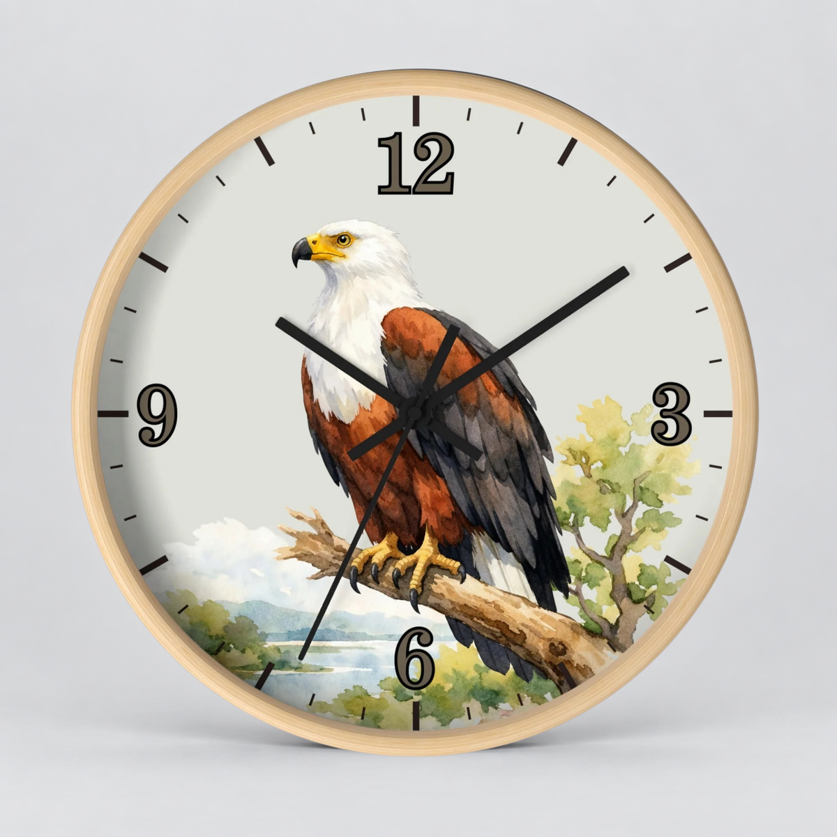 Round wall clock with a light wood frame and a printed eagle illustration on the face, shown against a plain light gray background.
