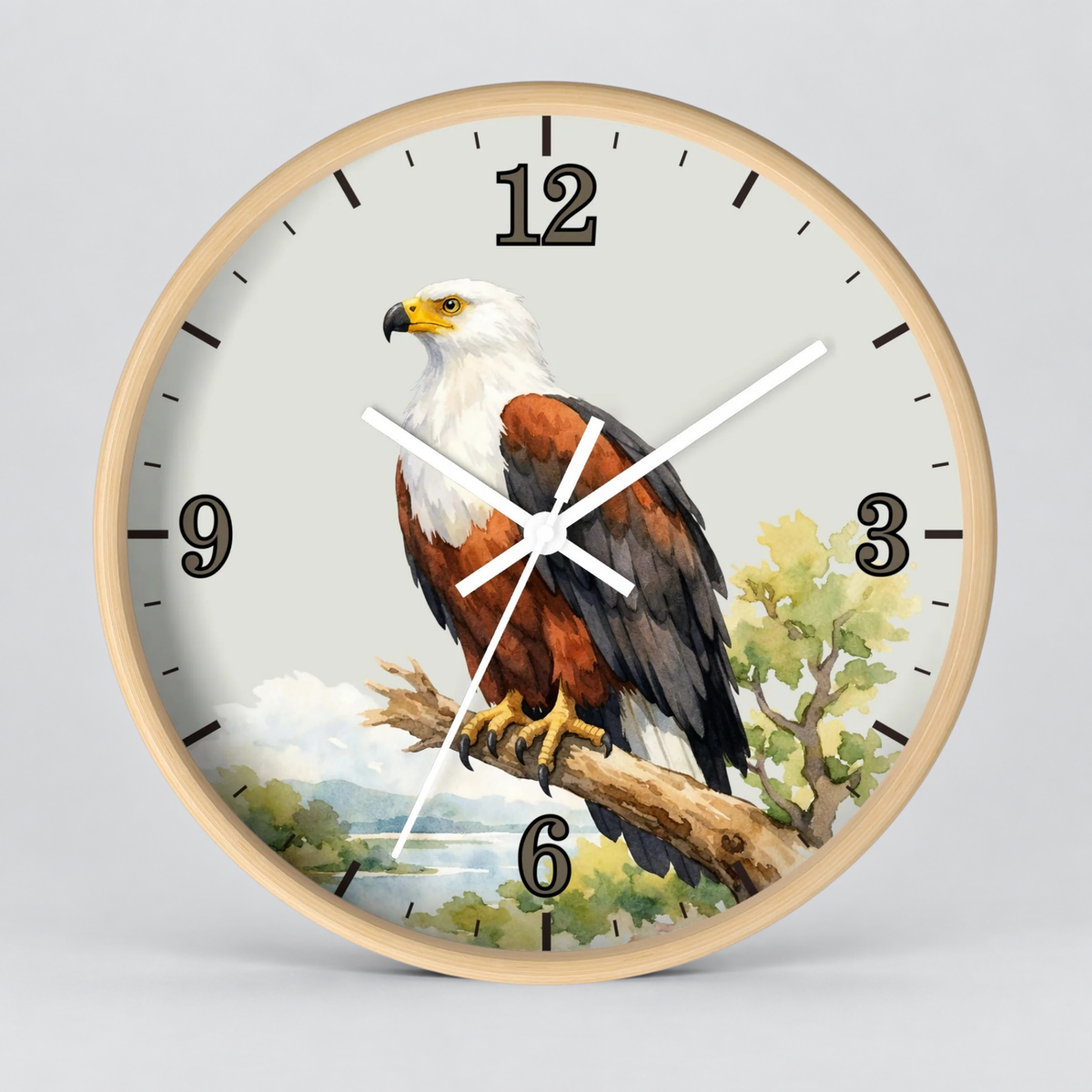 Round wall clock with a light wood frame and a printed eagle illustration on the face, shown against a plain light gray background.