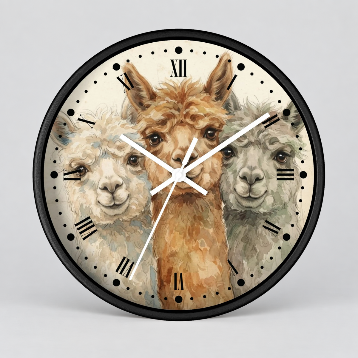 Round wall clock with a black frame and a printed illustration of three alpaca faces on the clock face, with black Roman numerals and white hands, shown against a light gray background.