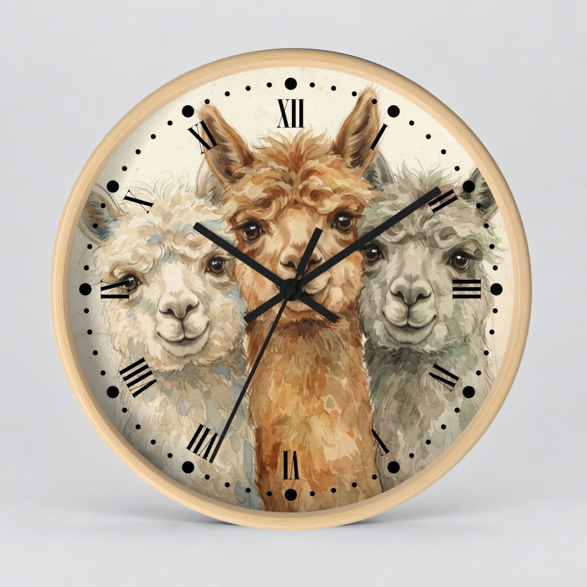 Round wall clock with a light wood frame and a printed dial featuring three alpaca faces in soft watercolor-style artwork, with black Roman numerals and hands on a light gray background.