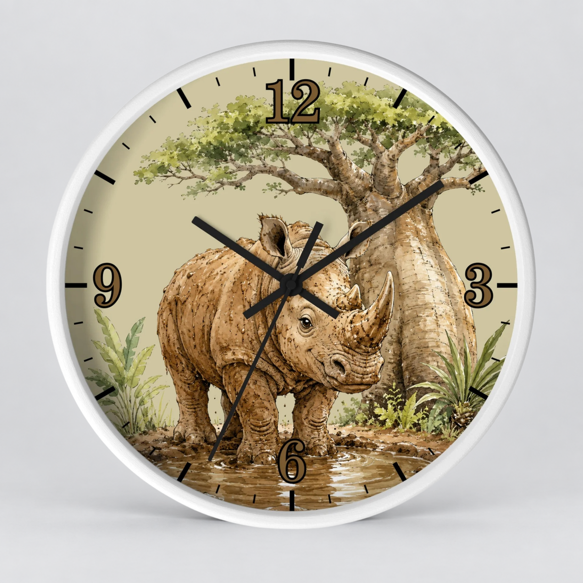A round wall clock with a white frame and a safari-themed illustration on the face, featuring a rhinoceros standing in water beneath a baobab tree. The clock has black hands, black hour markers, and a light beige background.