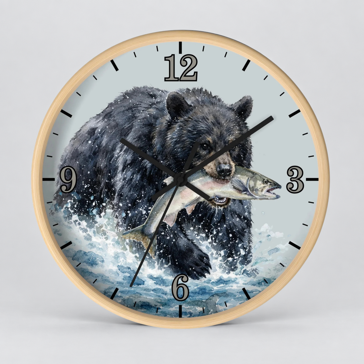 Round wall clock with a light wood frame and a printed illustration of a black bear carrying a fish across the face, with black numerals and hands on a light gray background.