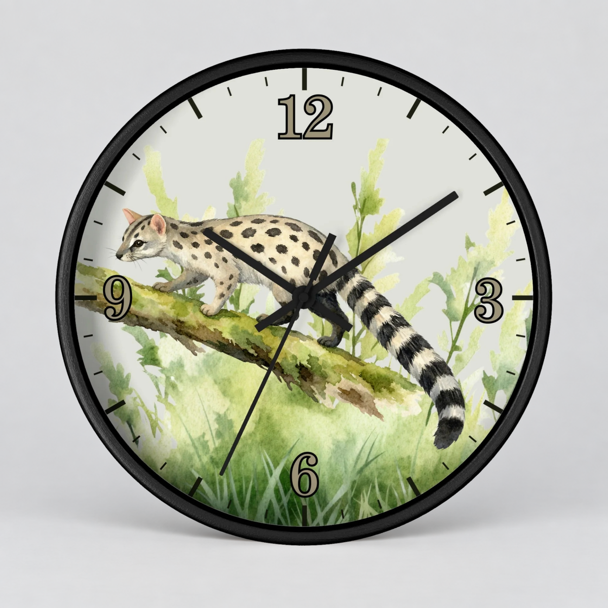 A round wall clock with a black frame and a printed watercolor-style illustration of a spotted cat walking along a branch in green grass. The clock face has black numeral markers and black hands, shown against a light gray background.