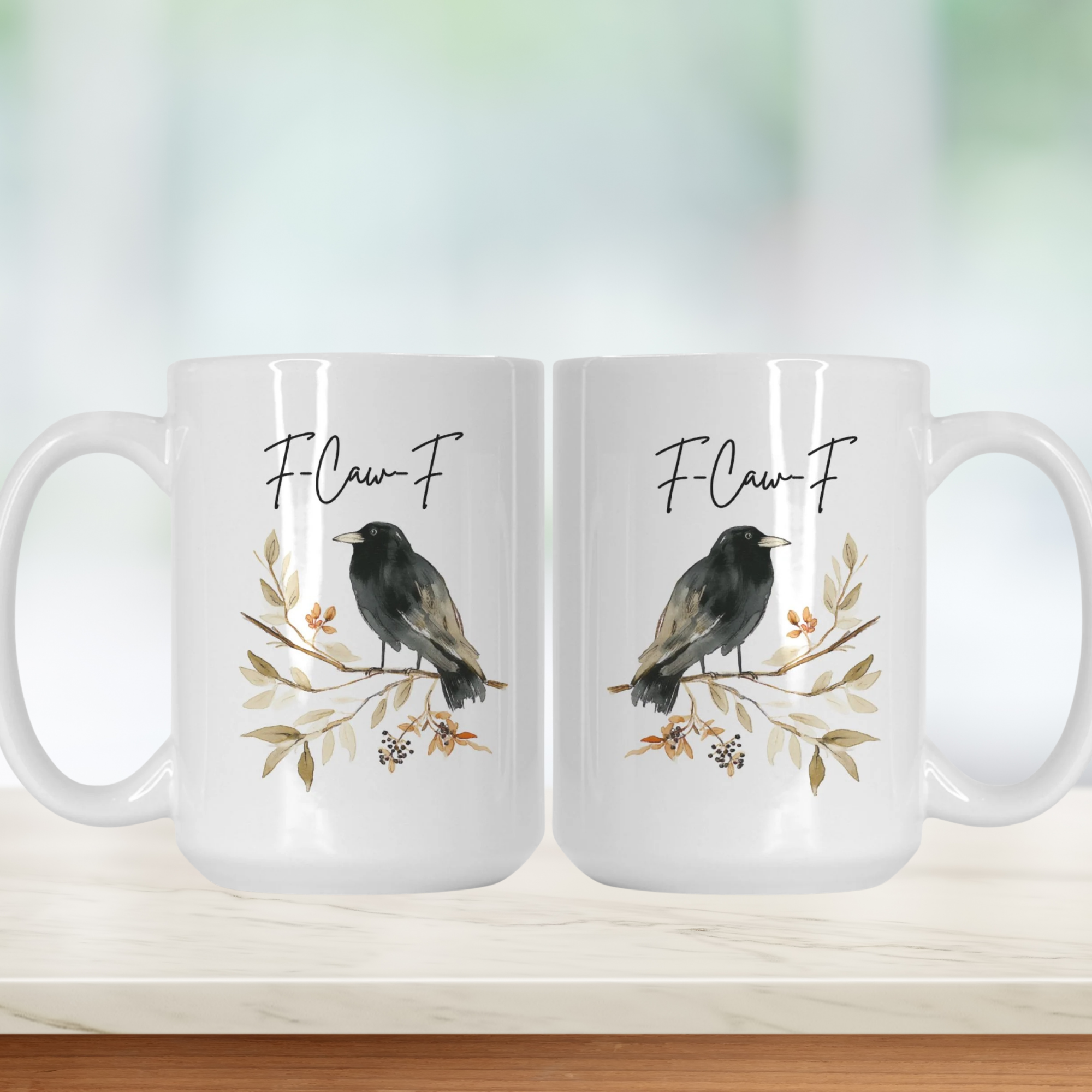 Two white mugs with bird illustrations and 'F-Law-F' text on a light background