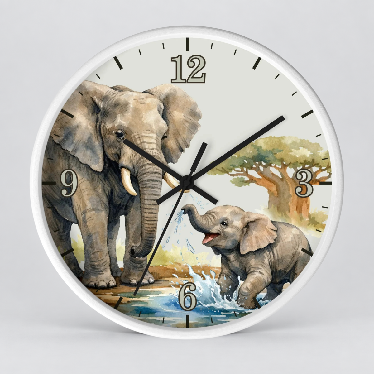A round wall clock with a white frame and a printed safari scene on the face, featuring two elephants, a tree, and black Arabic numerals, shown against a light gray background.