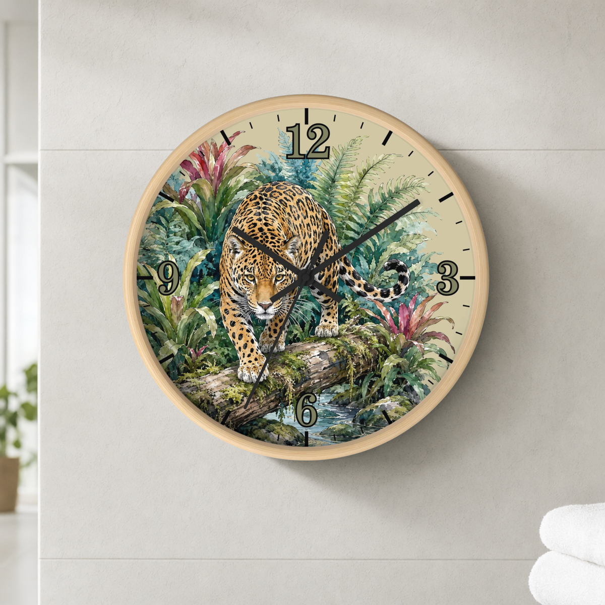 A round wall clock with a light wood frame and a detailed illustration of a leopard in a lush jungle scene, mounted on a light gray tiled wall.