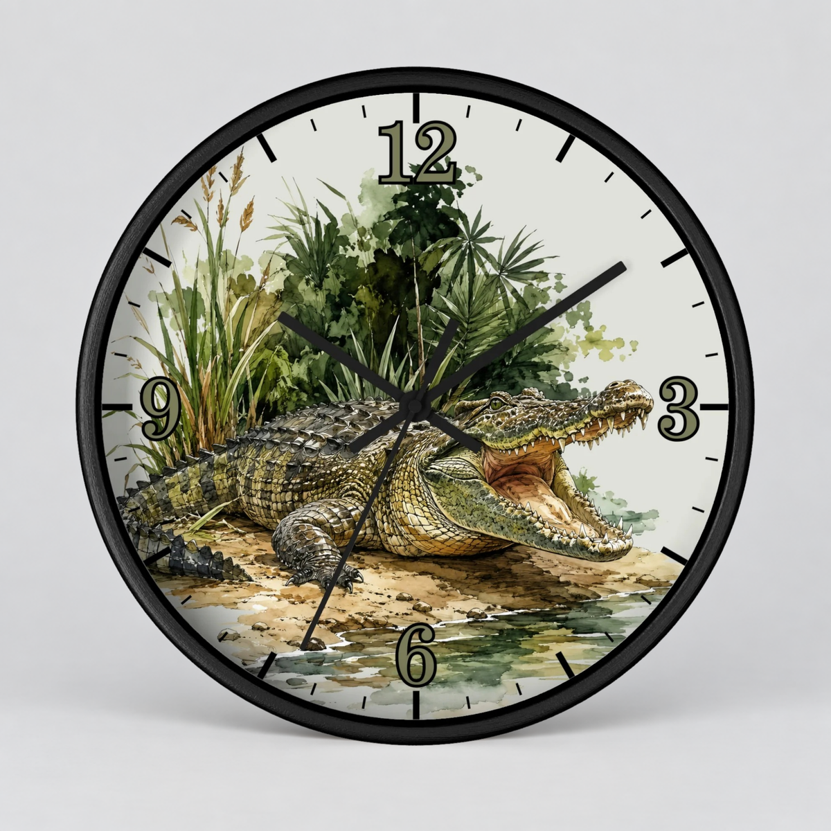 A round wall clock with a black frame and black hands, featuring a detailed illustration of a crocodile on a riverbank with green foliage and beige numerals on a light background.