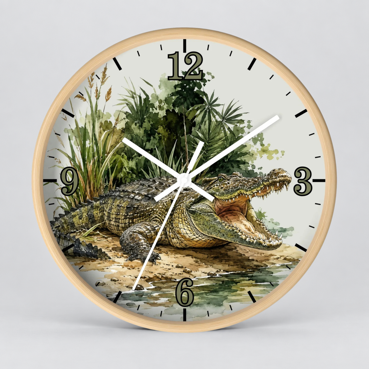Round wall clock with a light wood frame and a printed alligator illustration on the face, with black Arabic numerals and white hands, shown against a light gray background.