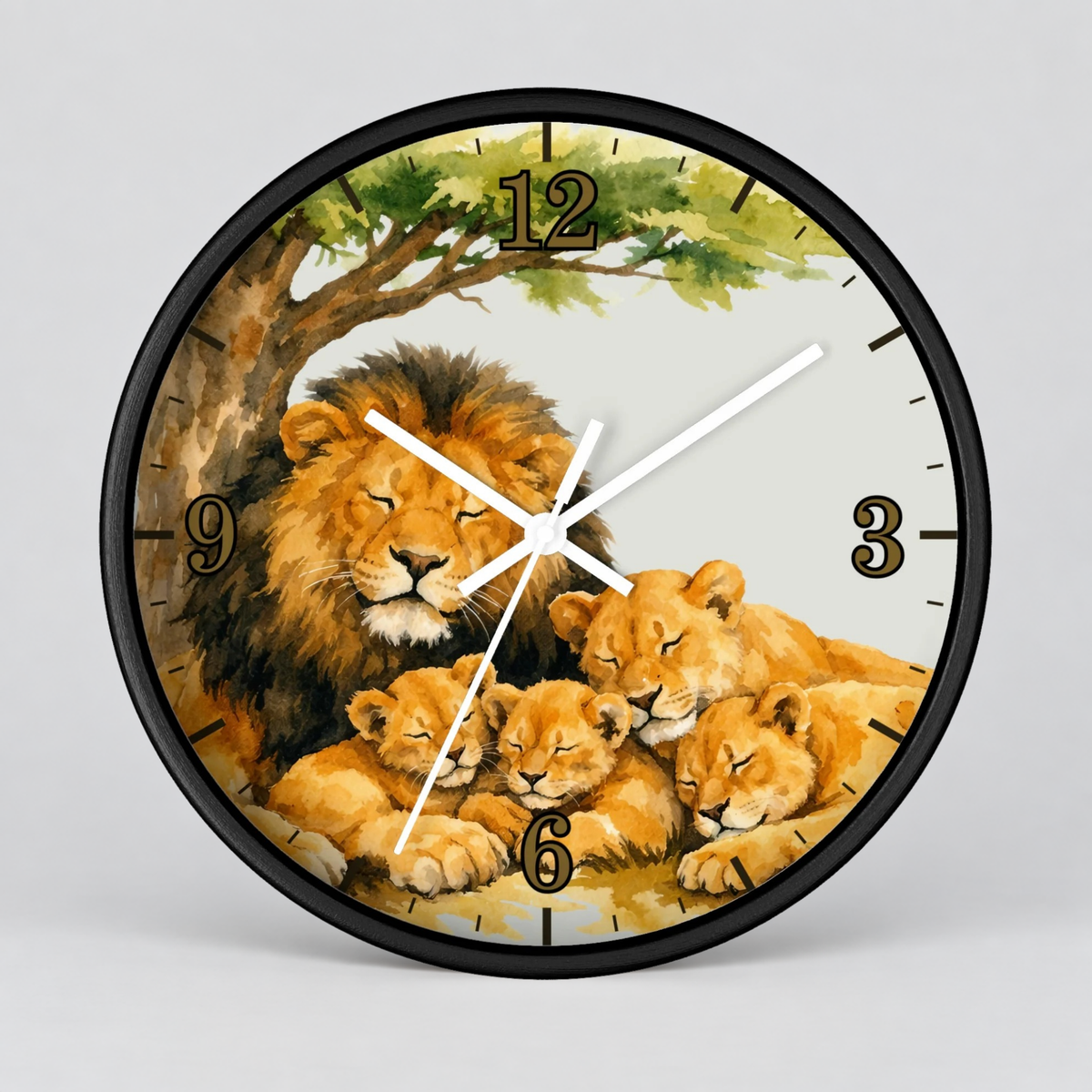 Round wall clock with a black frame and a printed safari illustration featuring a lion and three lion cubs under a tree, with white clock hands and black numerals on a light gray background.