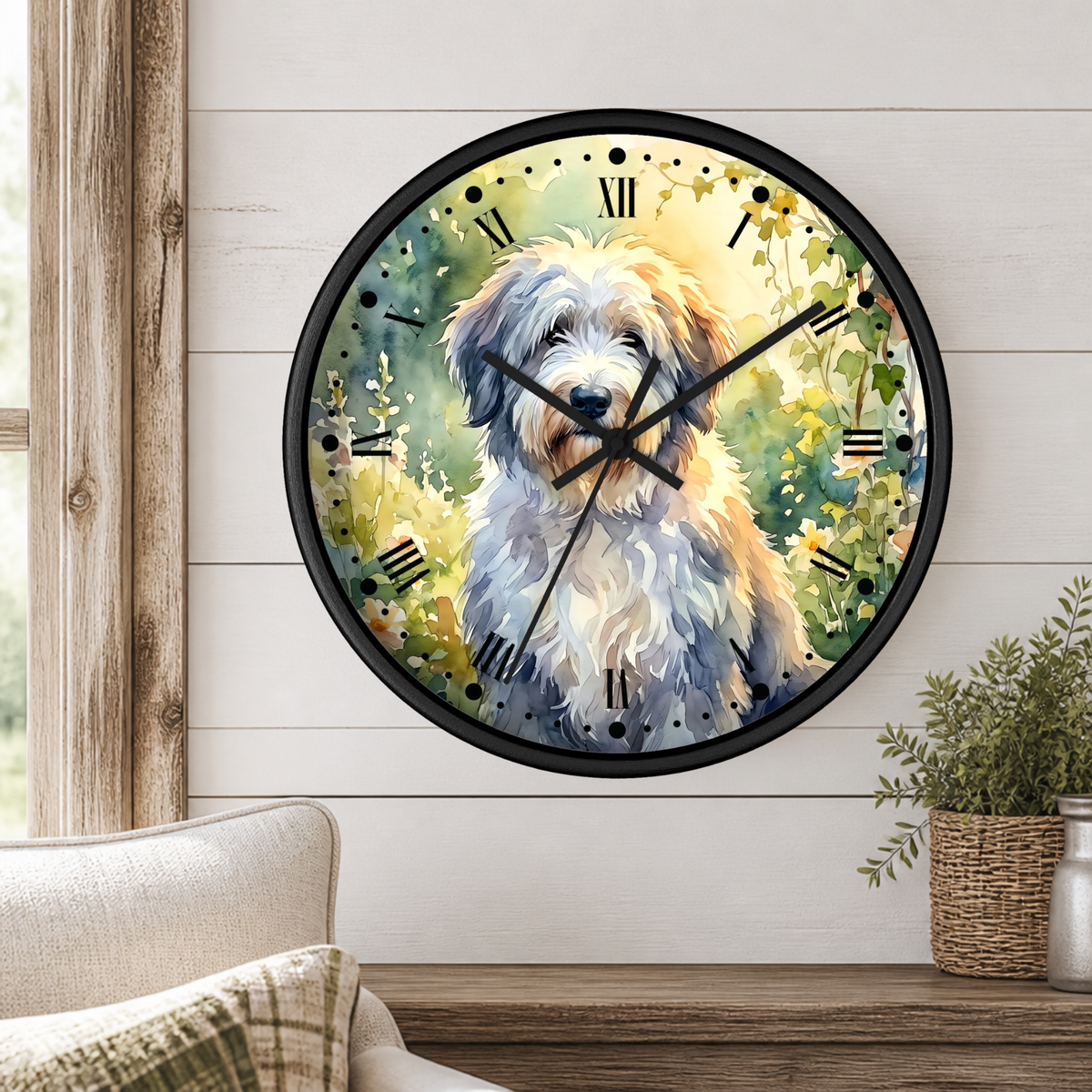 A round wall clock with a black frame and a watercolor-style illustration of a fluffy white and tan dog surrounded by green foliage and yellow flowers. The clock is mounted on a white shiplap wall above a wooden mantel with a small potted plant.