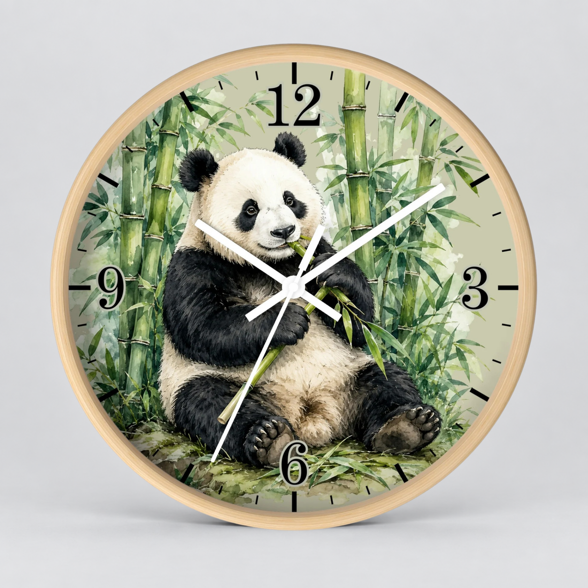 Round wall clock with a light wood frame featuring a printed panda sitting among green bamboo. The clock face has black Arabic numerals and white hands, photographed against a light gray background.