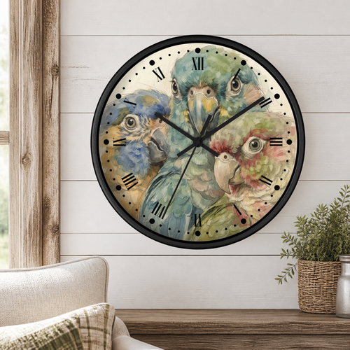 A round wall clock with a black frame and a watercolor-style parrot illustration on the face, mounted on a white shiplap wall above a wooden mantel with a small plant and part of a sofa visible.