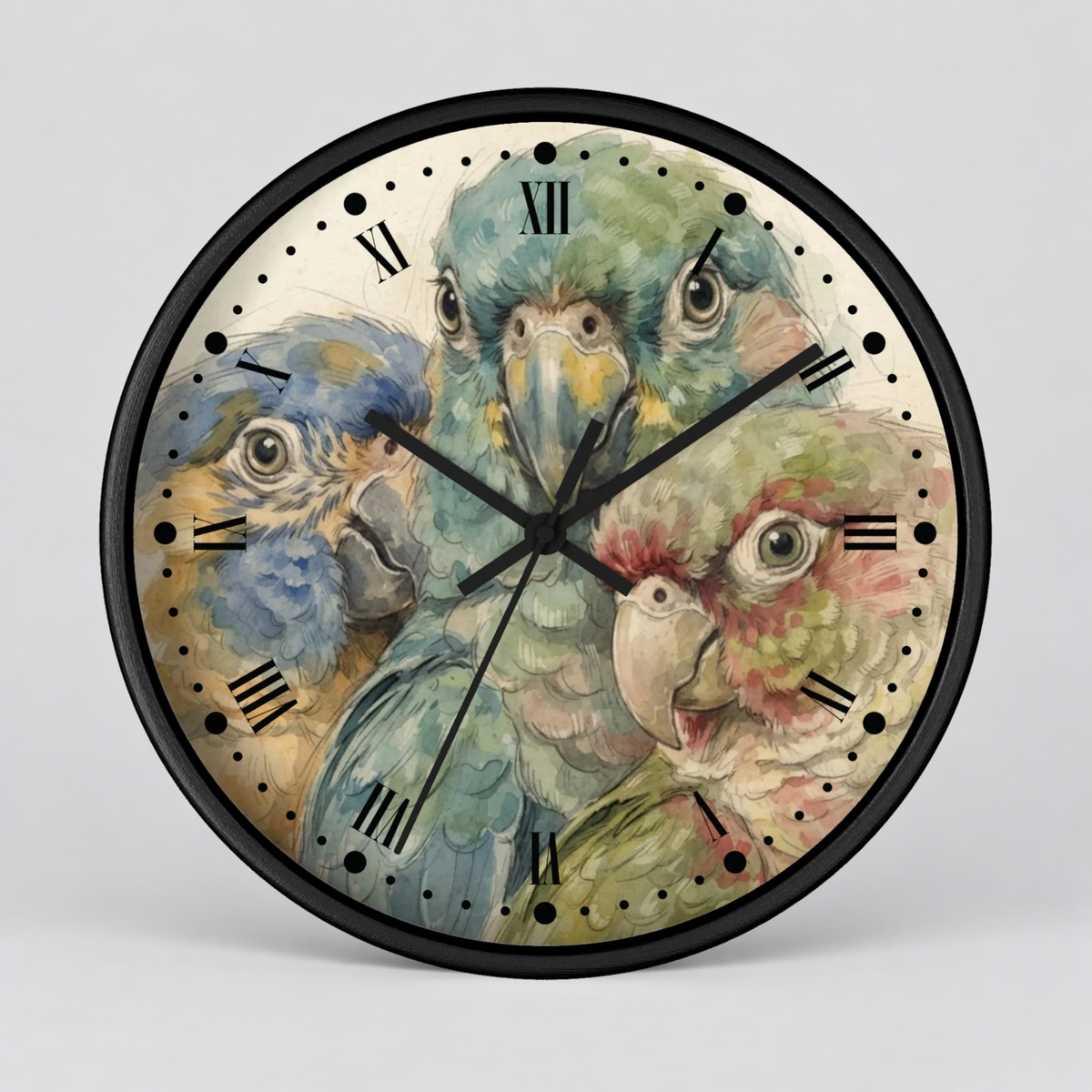 A round wall clock with a black frame and a printed parrot illustration on the face. The artwork shows three colorful parrots in soft watercolor tones, with black Roman numeral hour markers and black clock hands.