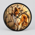 Round wall clock with a black frame, featuring a printed illustration of a collie dog standing in front of a vintage bicycle on a warm beige background with Roman numeral hour markers.