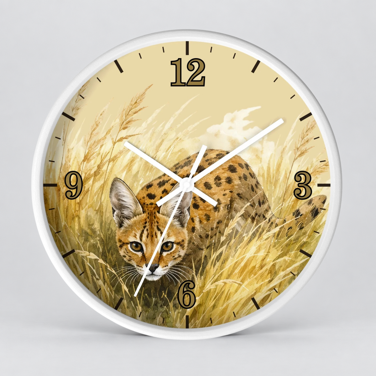 Round wall clock with a white frame and a printed design of a spotted big cat in tall golden grass, shown against a light gray background.