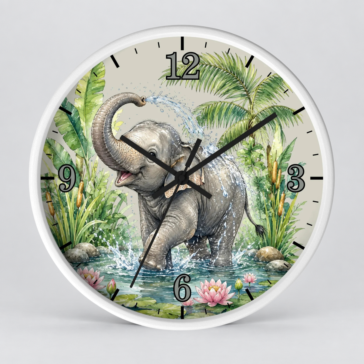 A round wall clock with a white frame and a printed illustration of a baby elephant standing in water among palm leaves and flowers. The clock face has black Arabic numerals and black clock hands, shown against a light gray background.