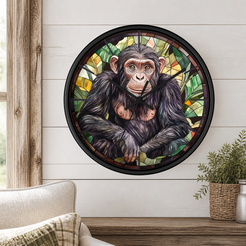 A round wall clock featuring a stained-glass-style illustration of a chimpanzee, mounted on a white shiplap wall above a wooden mantel with a small potted plant.