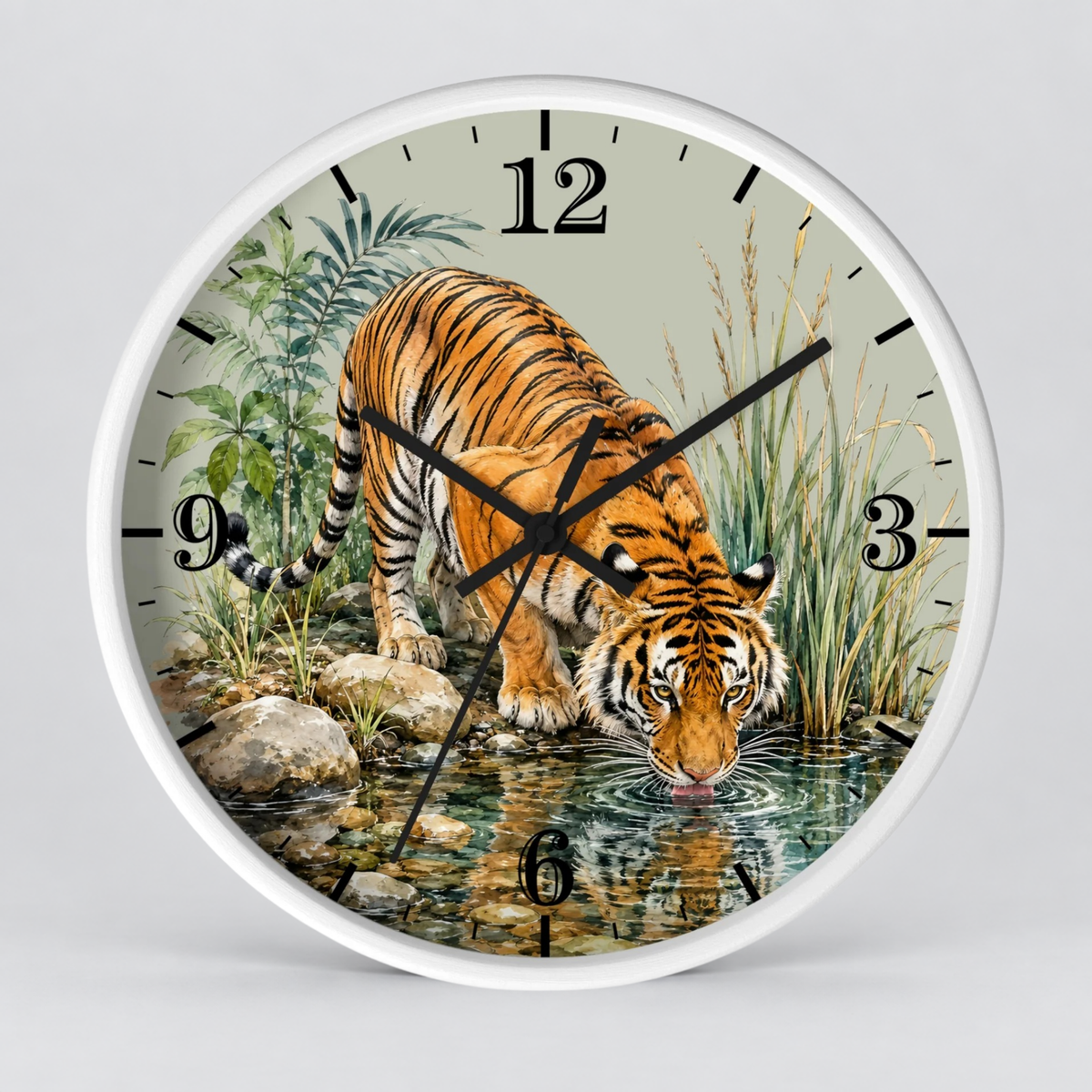 A round wall clock with a white frame and a printed illustration of a tiger drinking water from a stream, with black Arabic numerals and black clock hands, shown against a light gray background.