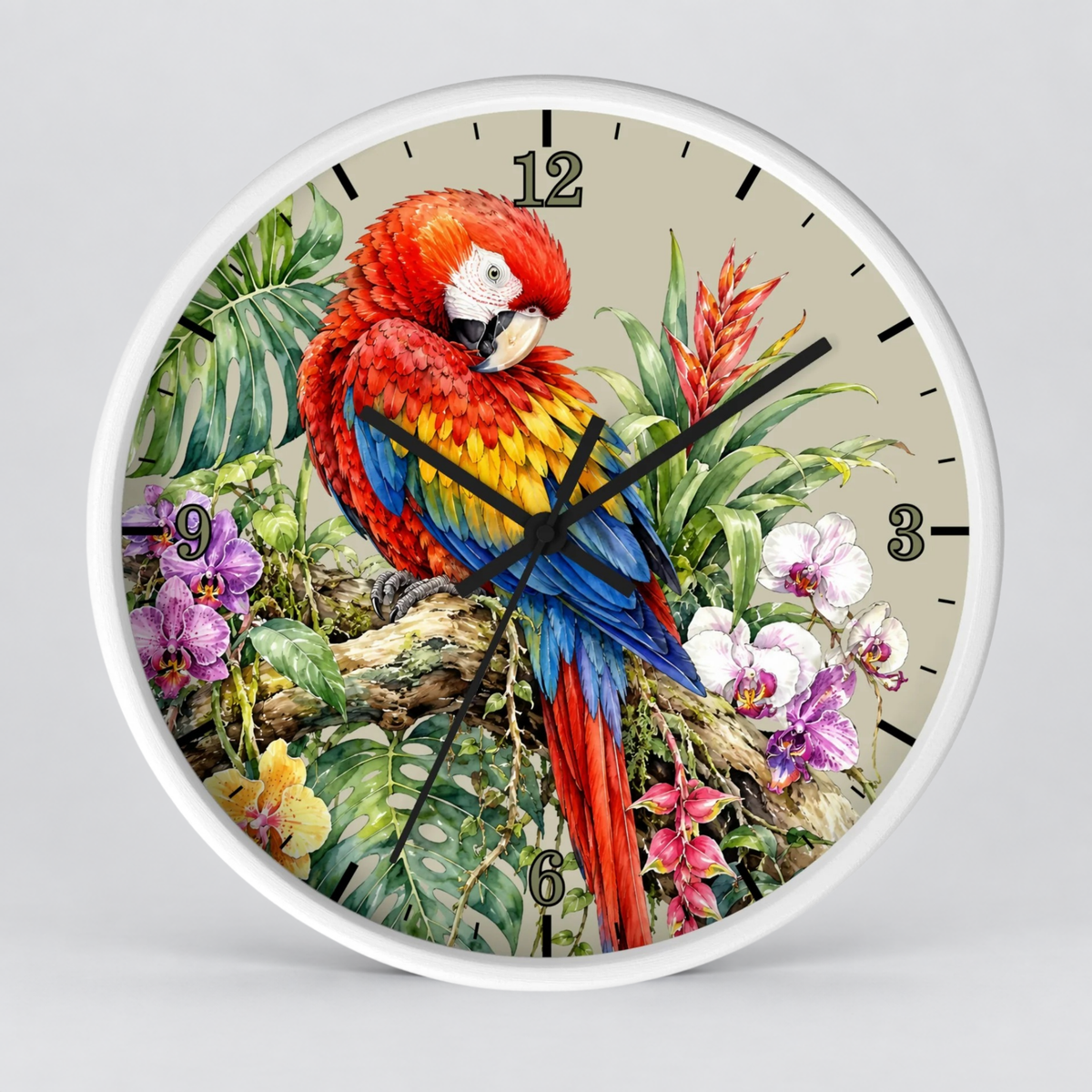 A round wall clock with a white frame and a tropical parrot illustration on the face. The parrot is red, yellow, and blue, perched among green leaves and purple flowers on a light beige background.