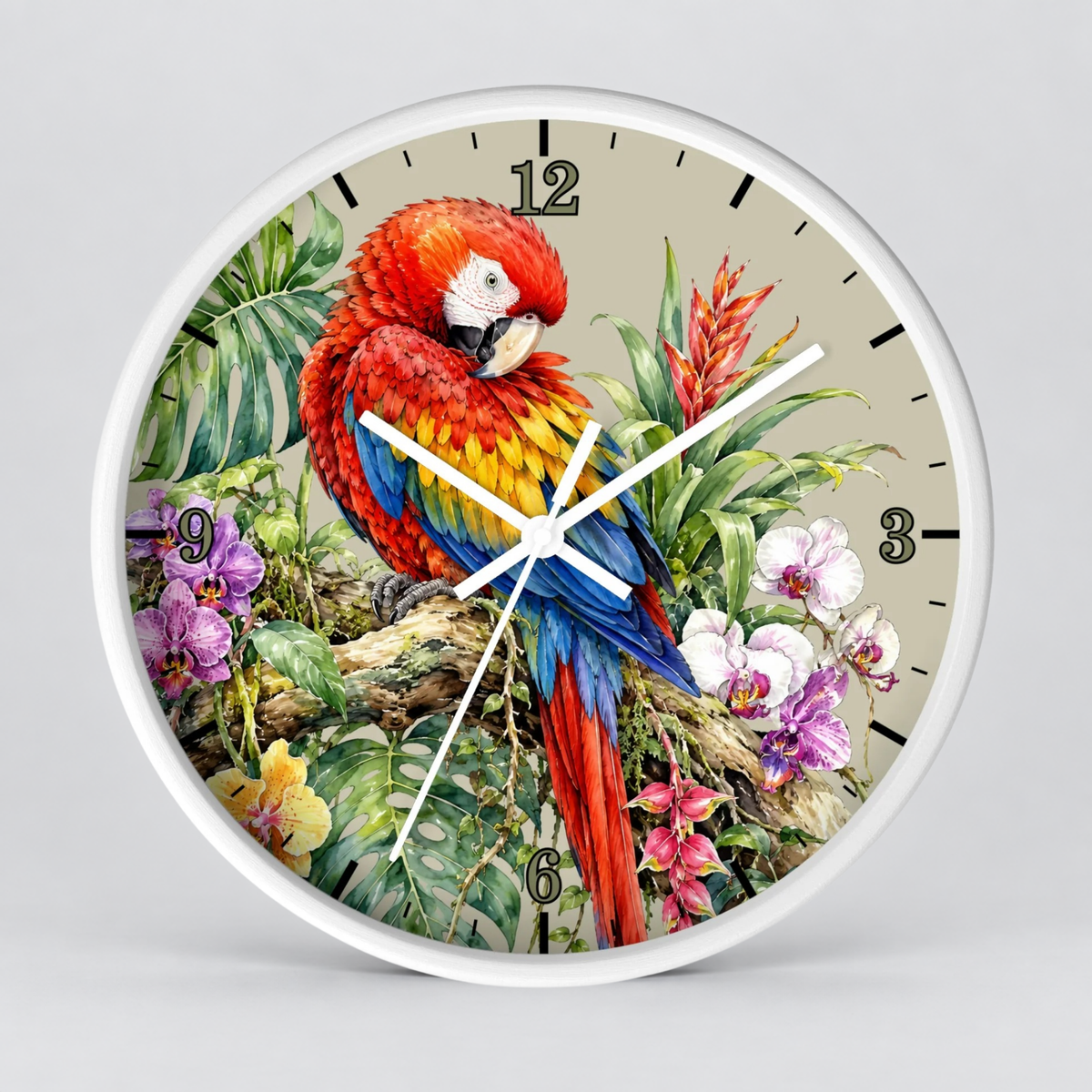 A round wall clock with a white frame and a detailed tropical parrot illustration on the face. The clock features a vibrant red, yellow, and blue parrot perched among green leaves and purple flowers on a light beige background, with black Arabic numerals and white clock hands.