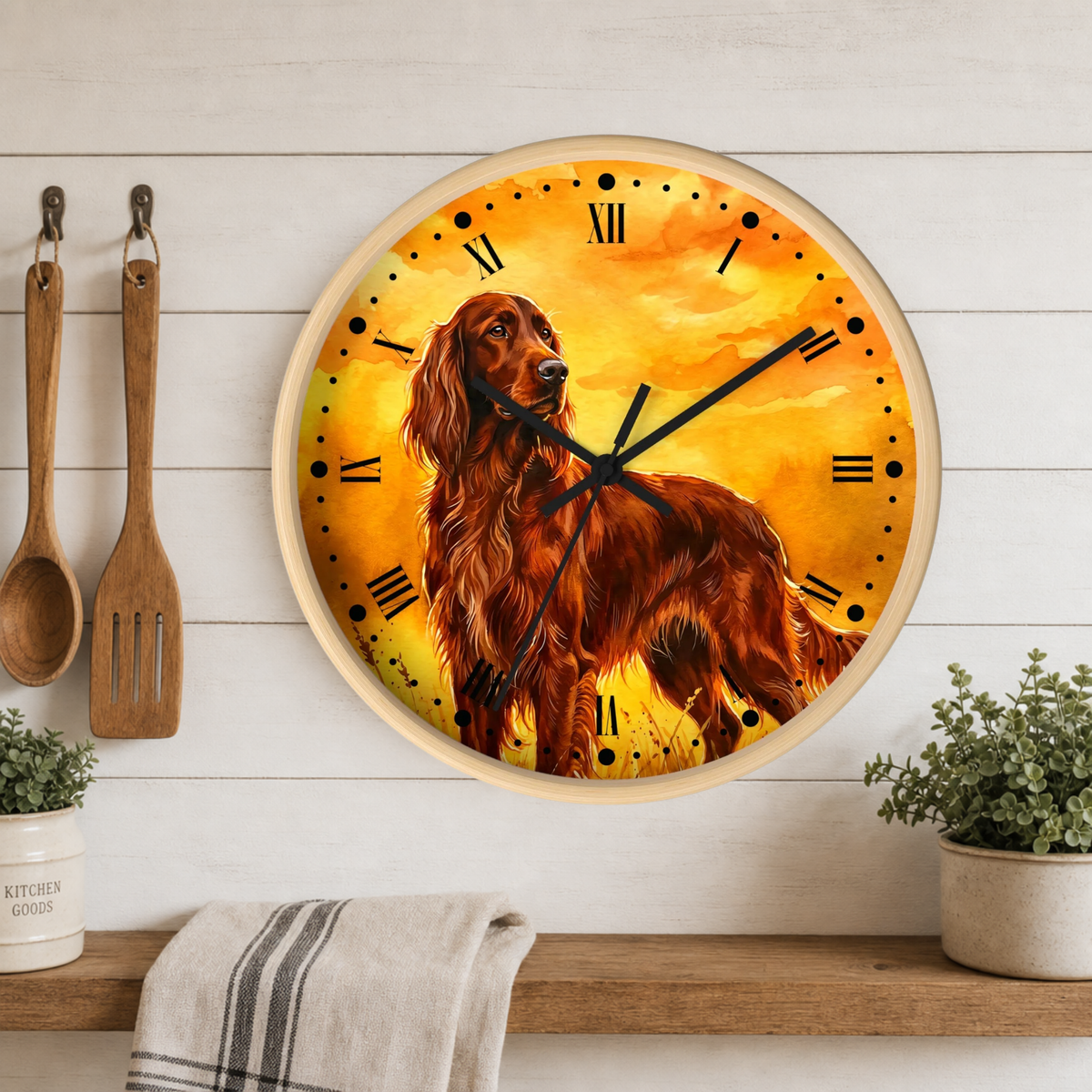 Round wall clock with a warm yellow and orange sunset-style background and a brown long-haired dog illustration, mounted on a white wood plank wall above a shelf with plants and kitchen utensils.