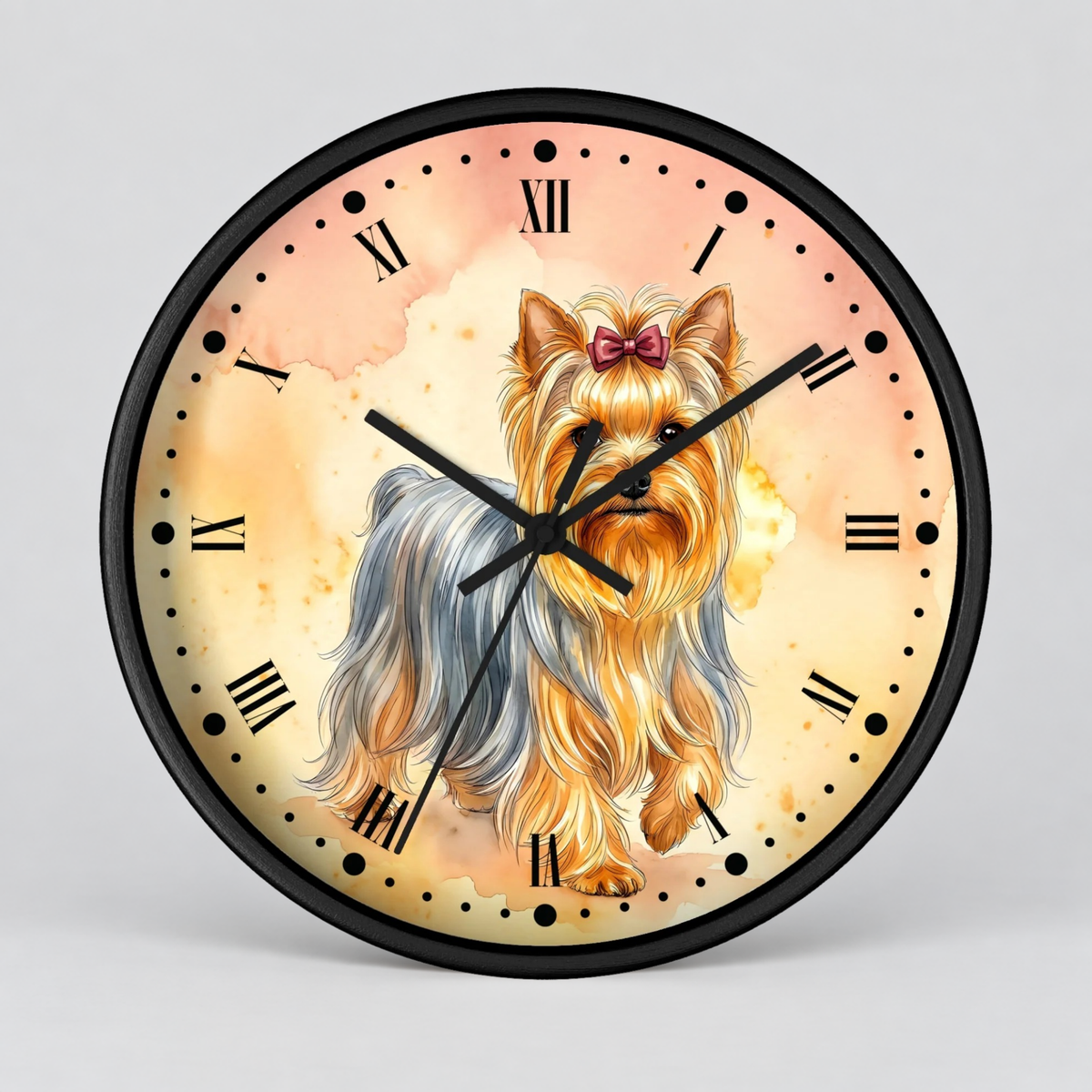 A round wall clock with a black frame and black Roman numeral hour markers, featuring a watercolor-style illustration of a long-haired golden and gray dog with a pink bow on the face. The clock is photographed against a neutral light gray background.