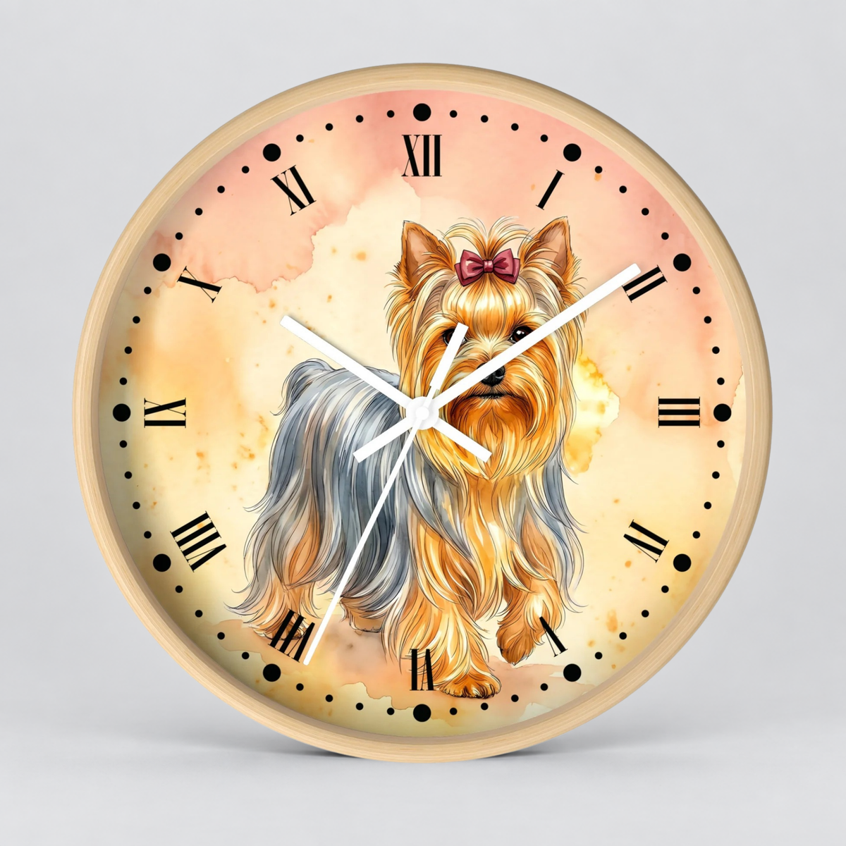 Round wall clock with a watercolor-style illustration of a Yorkshire Terrier dog on the face, Roman numeral hour markers, black dot hour positions, white clock hands, and a light wood-toned rim, shown against a plain light gray background.