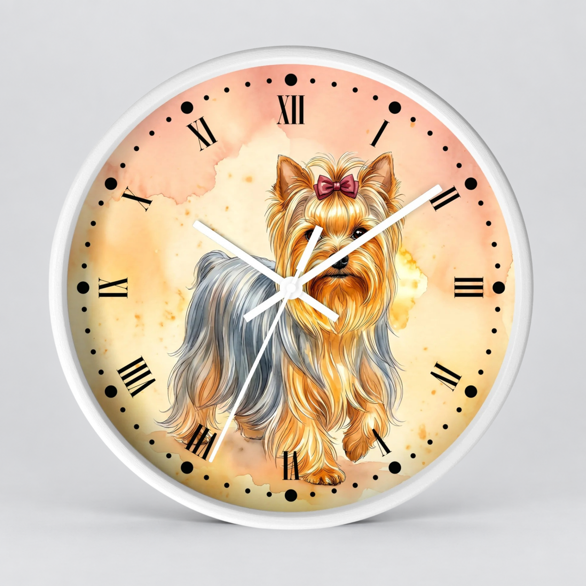 Round wall clock with a white frame and a printed dial featuring a Yorkshire Terrier illustration on a warm peach and cream watercolor-style background with black Roman numerals and white hands.