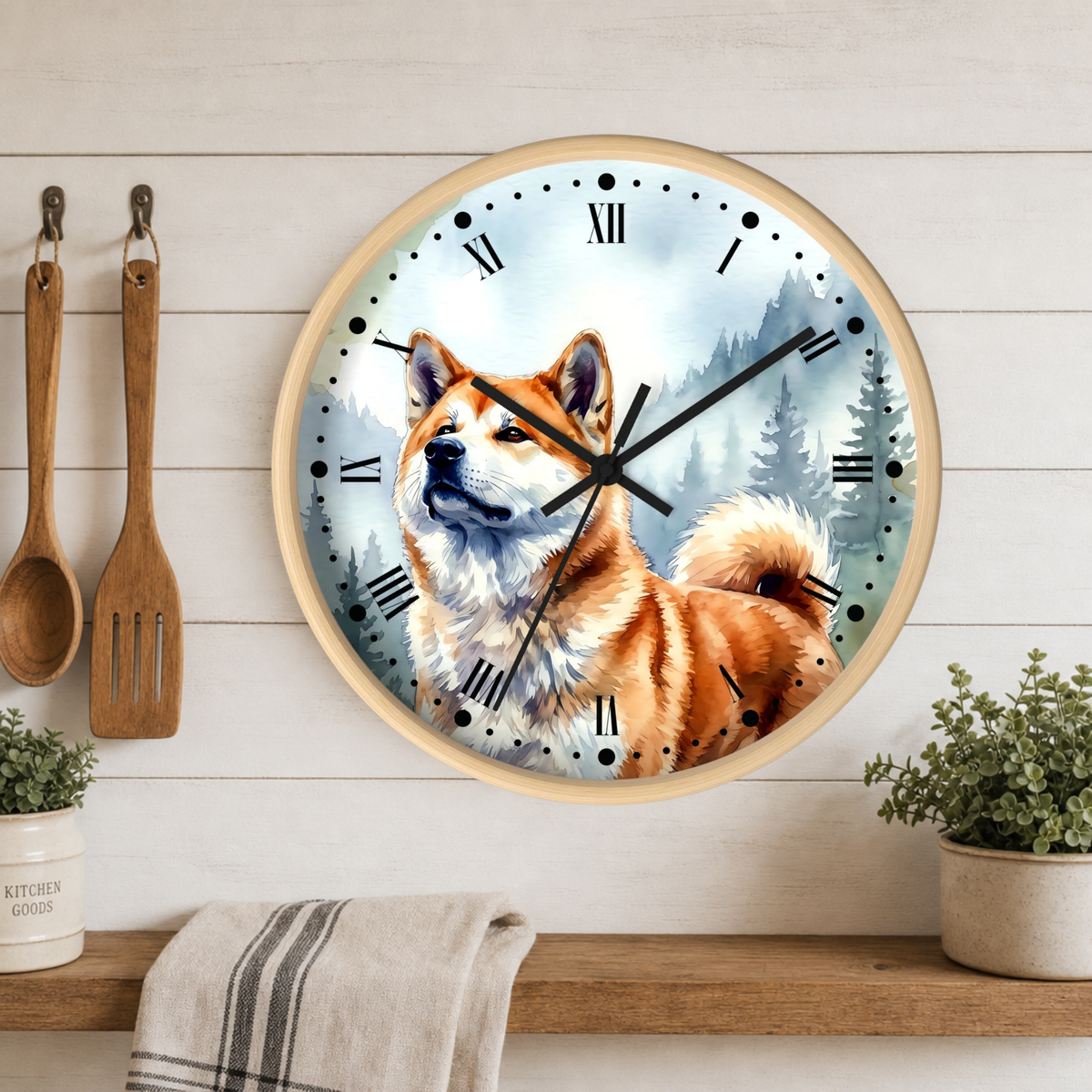 Round wall clock with a light wood frame featuring a painted Shiba Inu dog on the face, mounted on a white wood plank kitchen wall above a wooden shelf with plants and utensils.