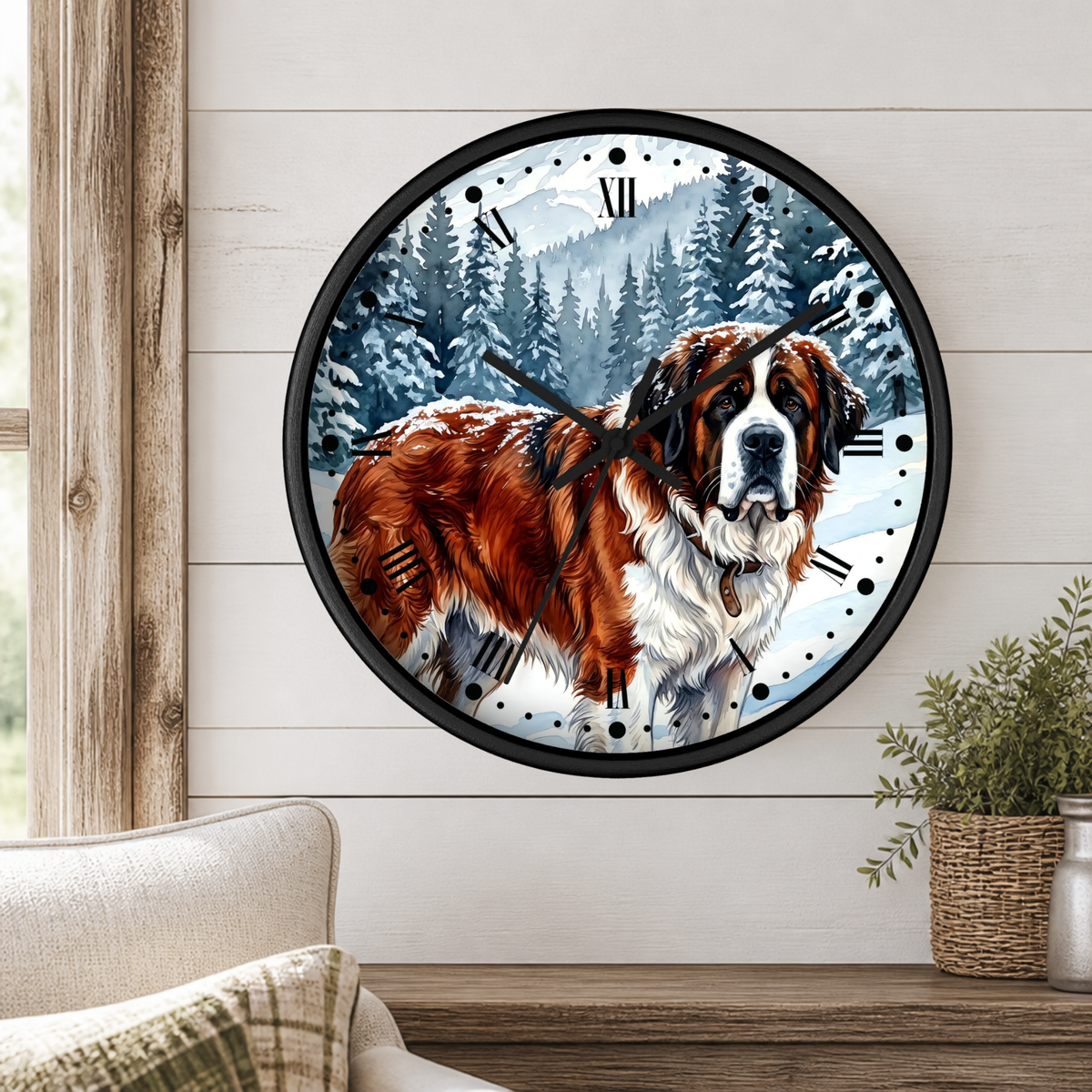A round wall clock with a black frame and a printed design of a Saint Bernard dog in a snowy mountain forest, mounted on a white wood-paneled wall above a wooden table with a plant.