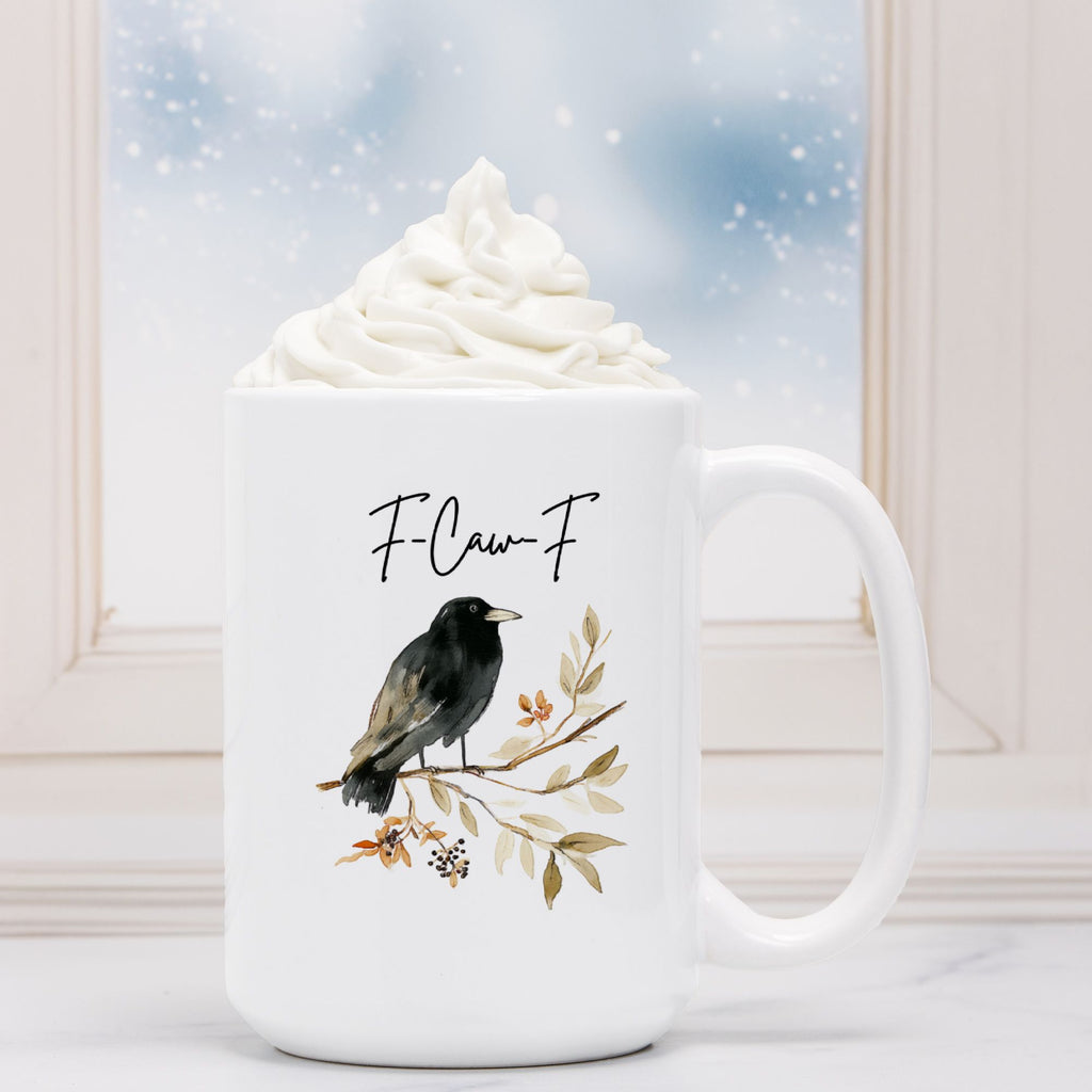 White mug with a bird design and 'F-Claw-F' text, filled with hot chocolate.