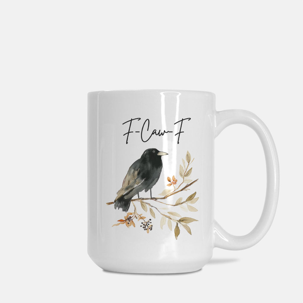 White mug with a bird illustration and floral elements on a white background